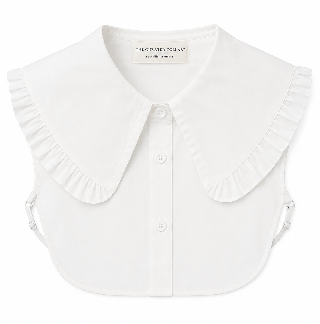 White blouse dickey with label The Curated Collar with dramatic ruffled collar on a white background