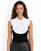 A woman modeling a white collar dickey or chemisette by the Curated Collar with adjustable sides and buttons against a plain white background.