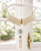 Pearl Dolly Parton collar with tags from the Curated Collar with hangar that reads the Curated Collar Nashville Tennessee
