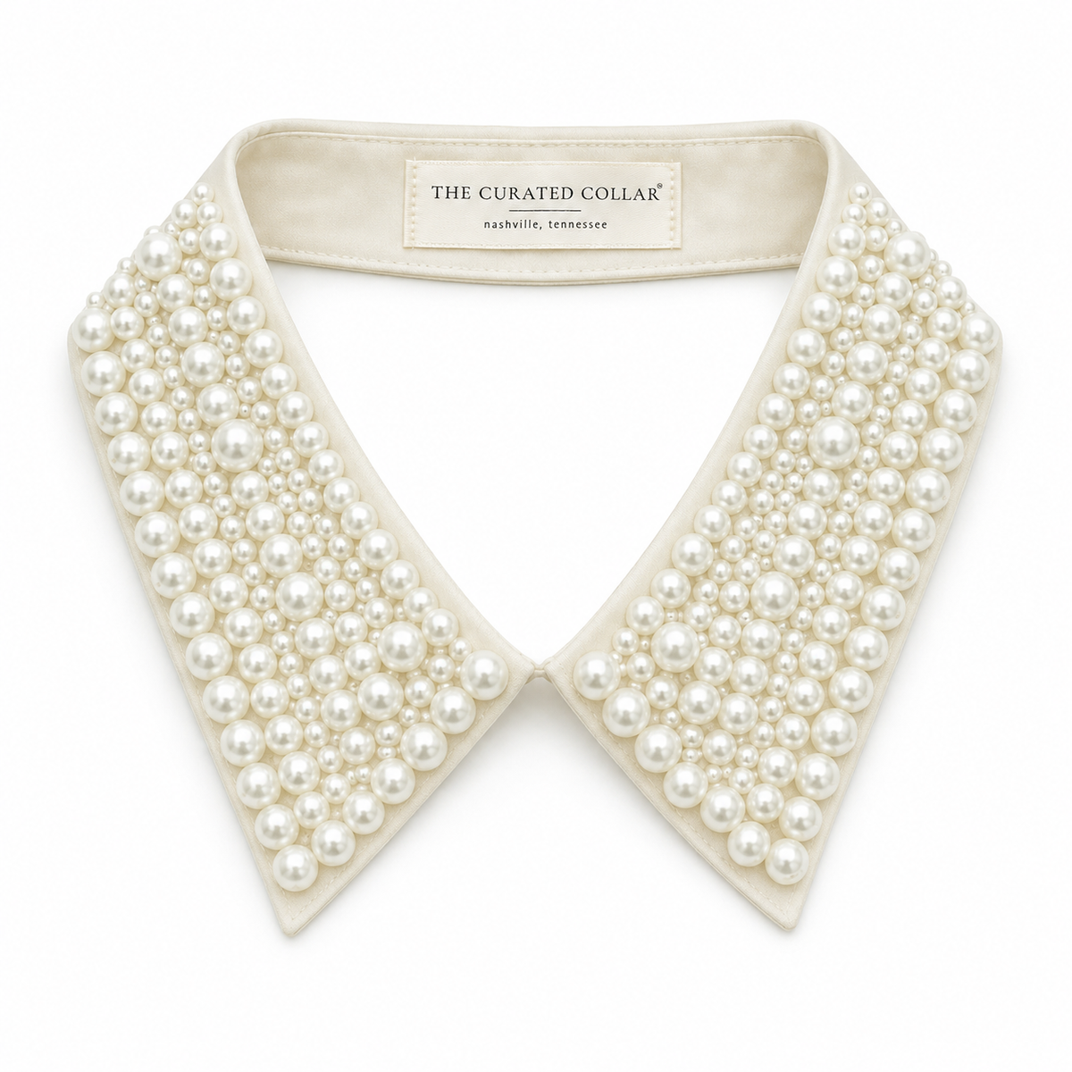 Pearl collar with 'The Curated Collar' Nashville Tennessee label on a white background