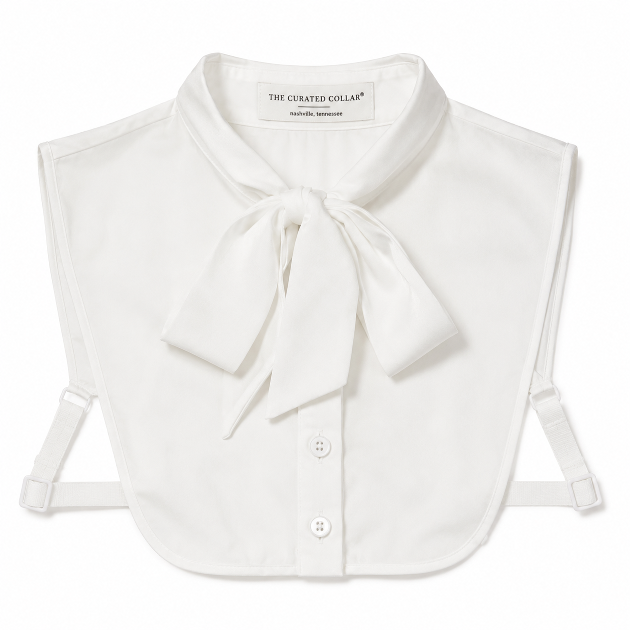 White collar with bow tie and buttons on a white background, branded 'The Curated Collar'.
